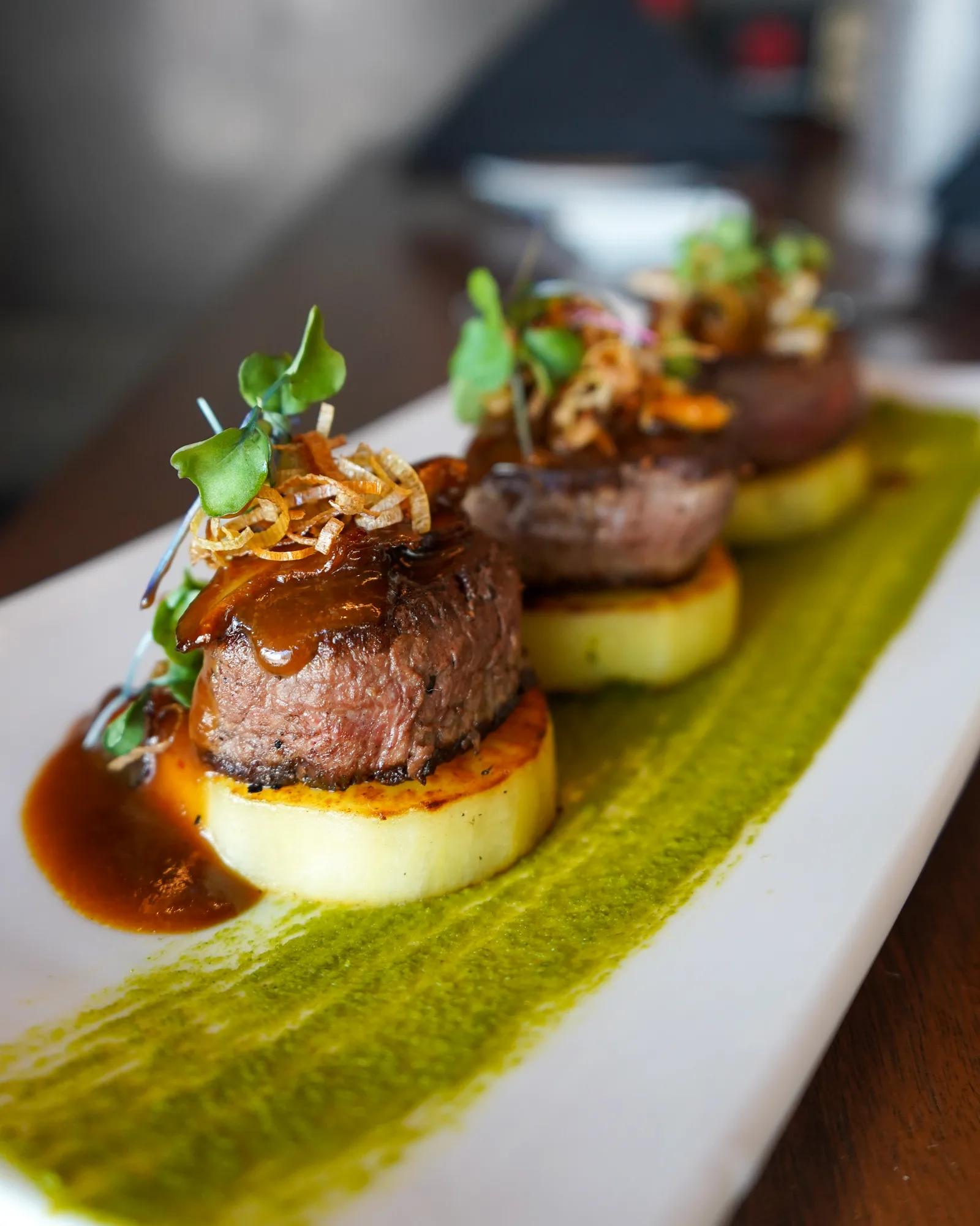 Steak medallions plated with sauce at Miyazaki